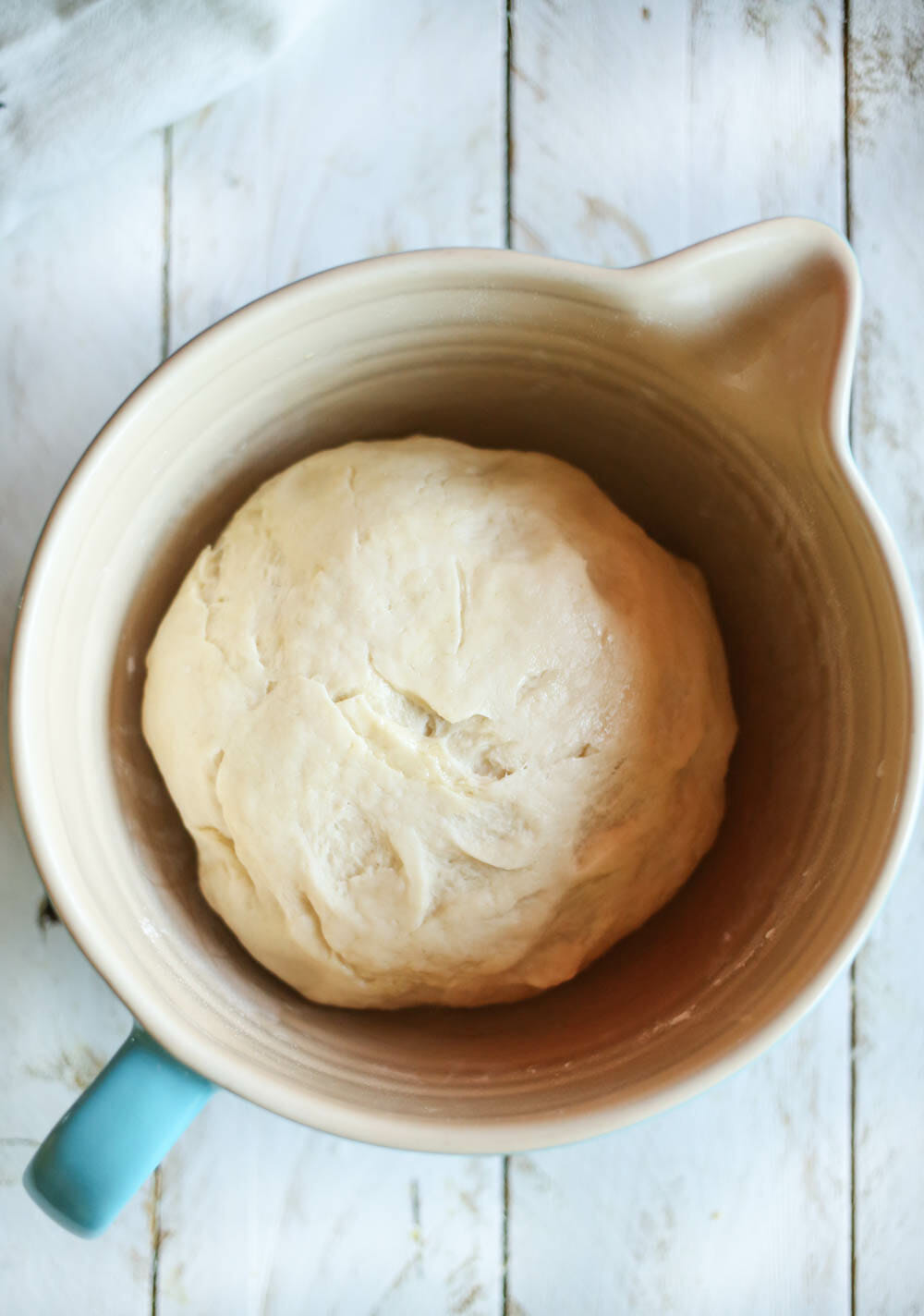 greased bowl with dough