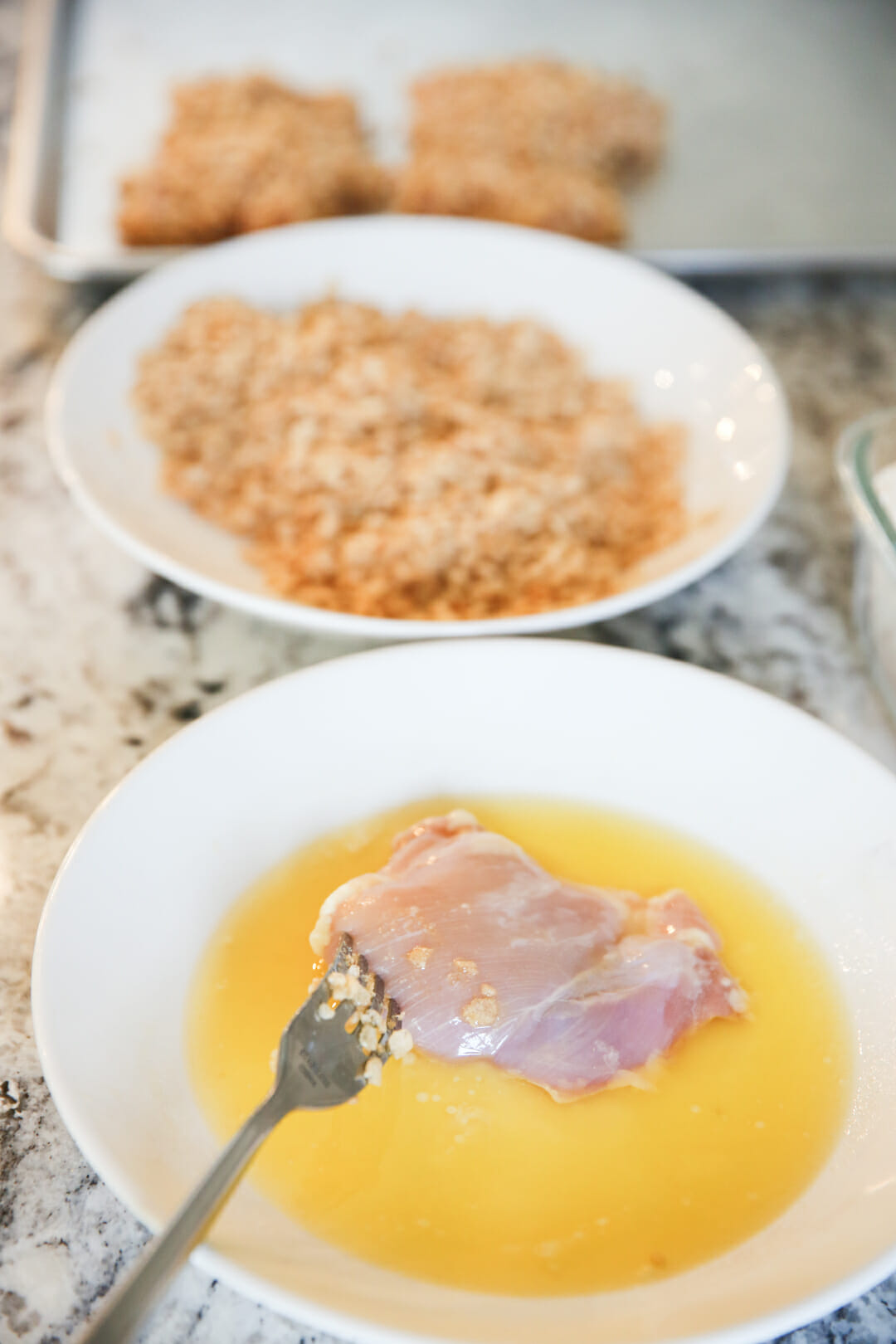 crispy baked chicken thighs dipped in butter