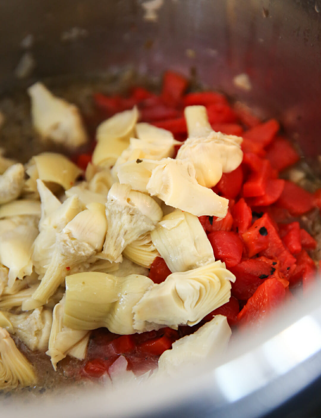 Diced red bell peppers and artichoke hearts