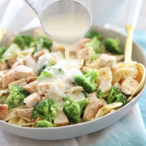 Cream sauce over pasta and broccoli