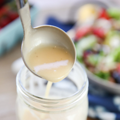 Honey Lemon Vinaigrette being poured