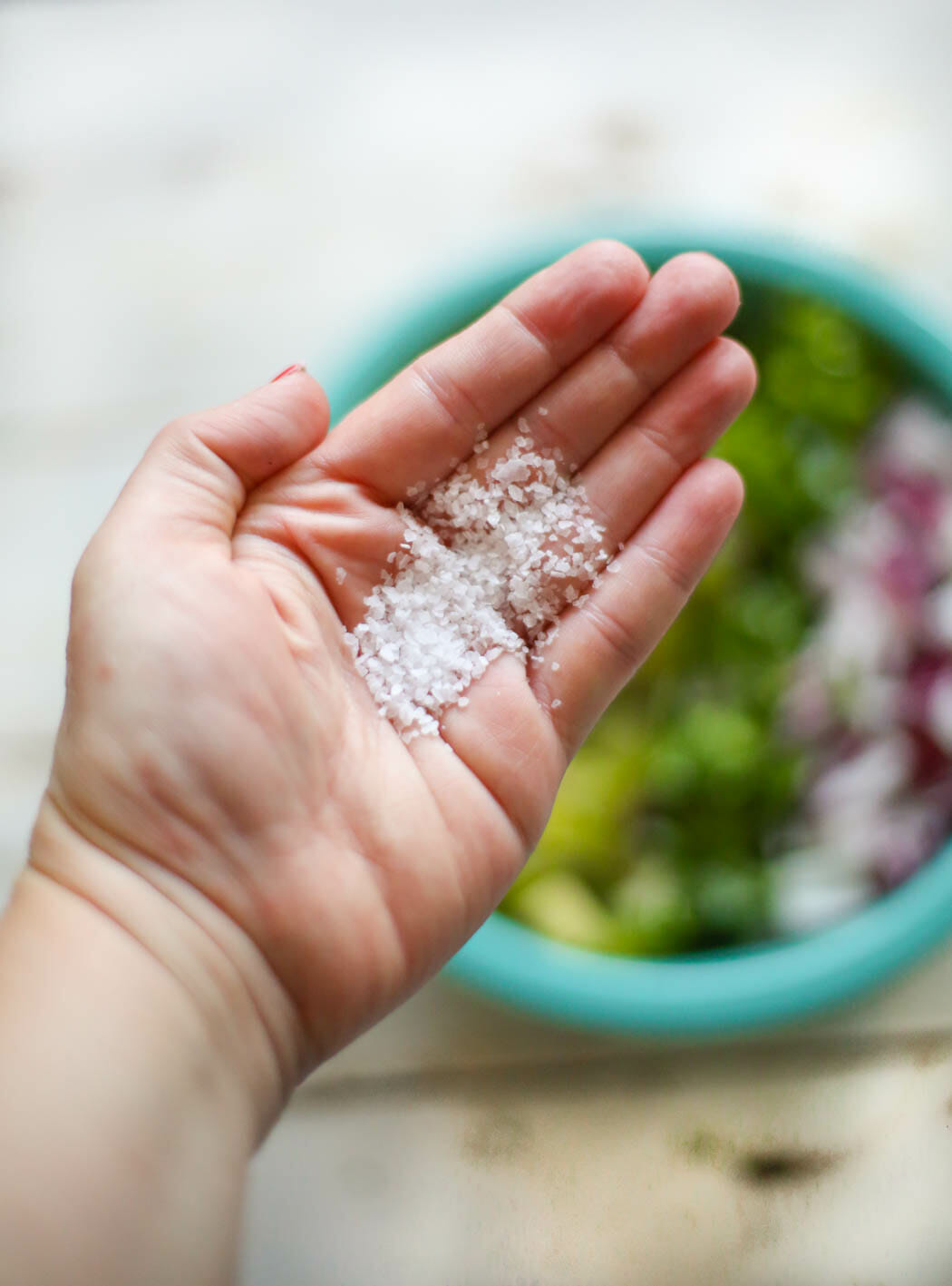 adding salt to kiwi mango salsa