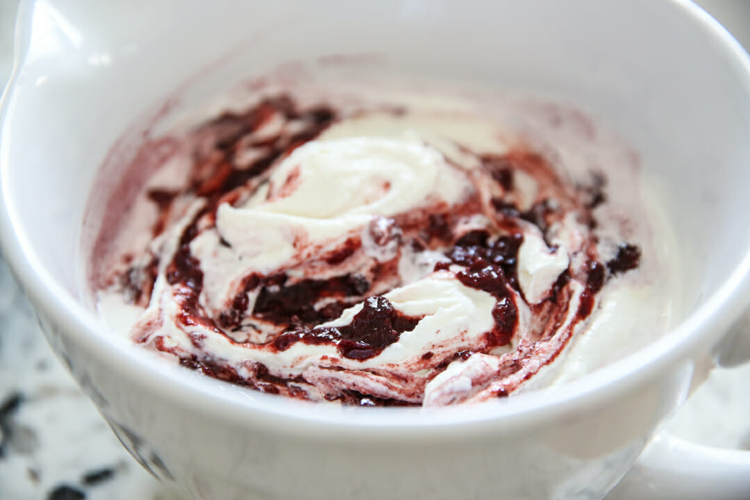 mixing cherries with ice cream batter