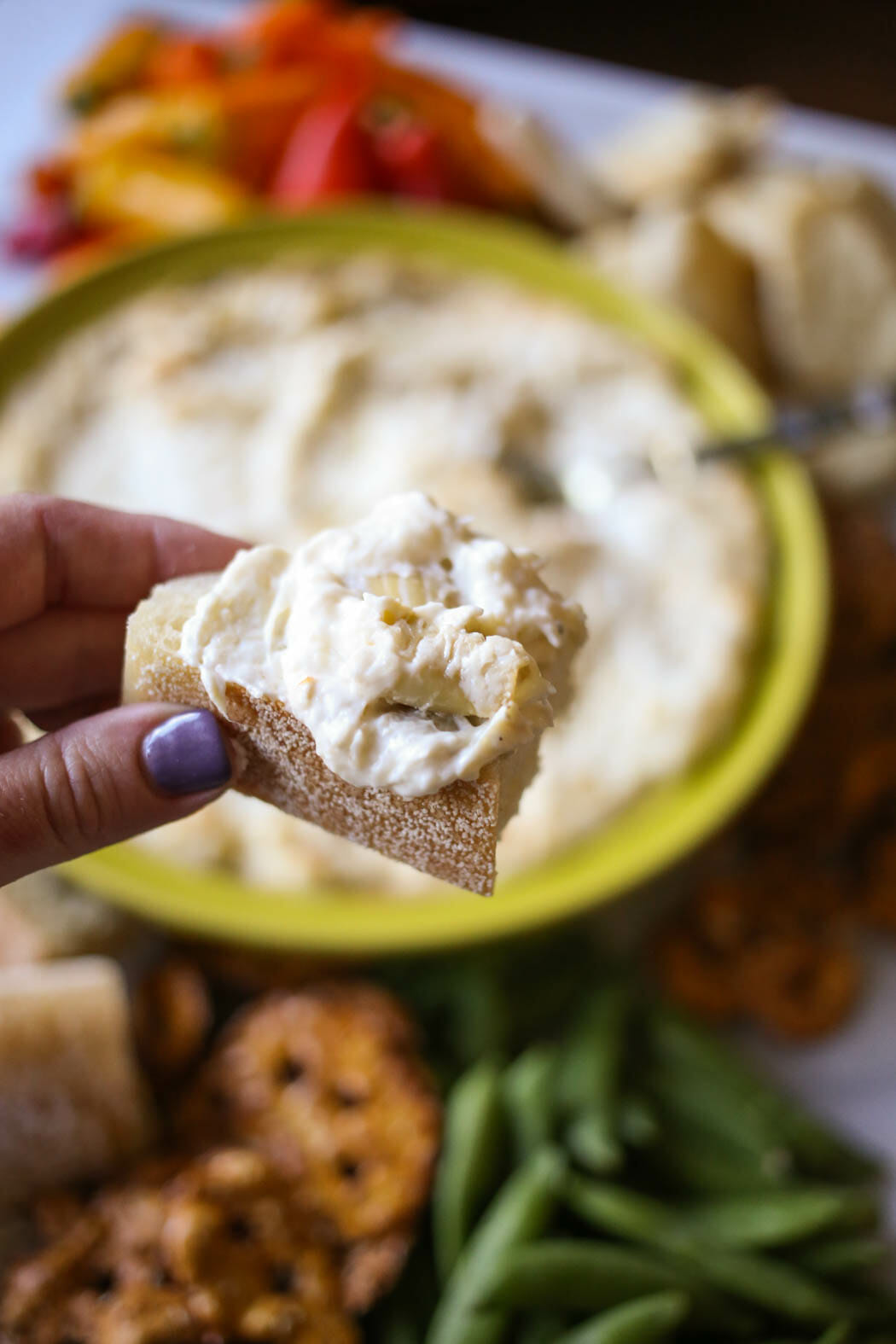 Garlic artichoke dip on bread from Our Best Bites