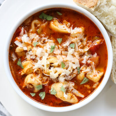 tortellini soup in a white bowl