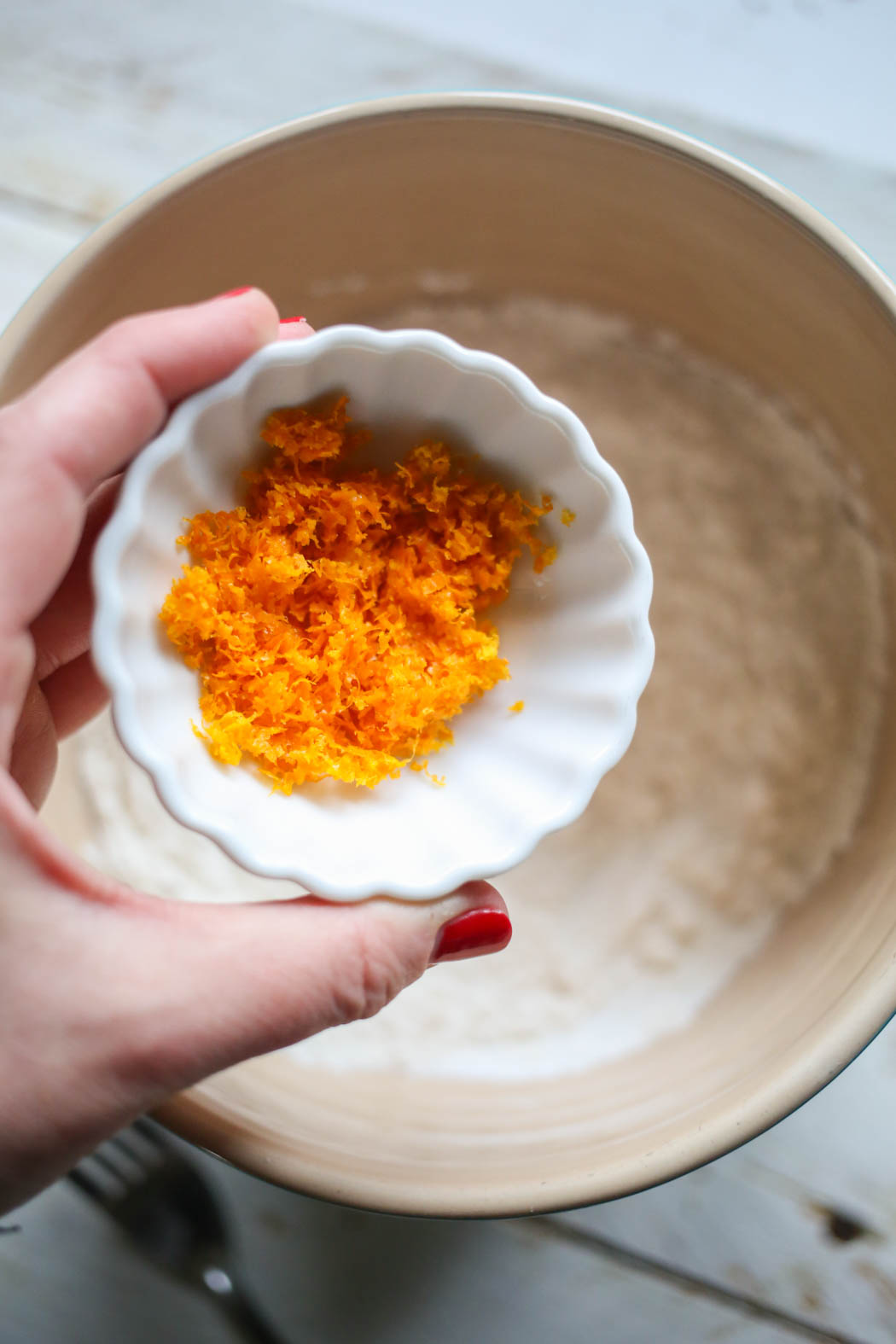 adding orange zest to Orange Cranberry Scones from Our Best Bites