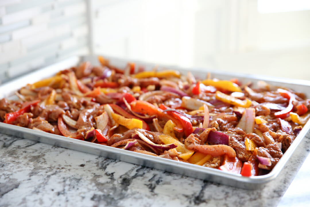 chicken fajita mix on baking sheet