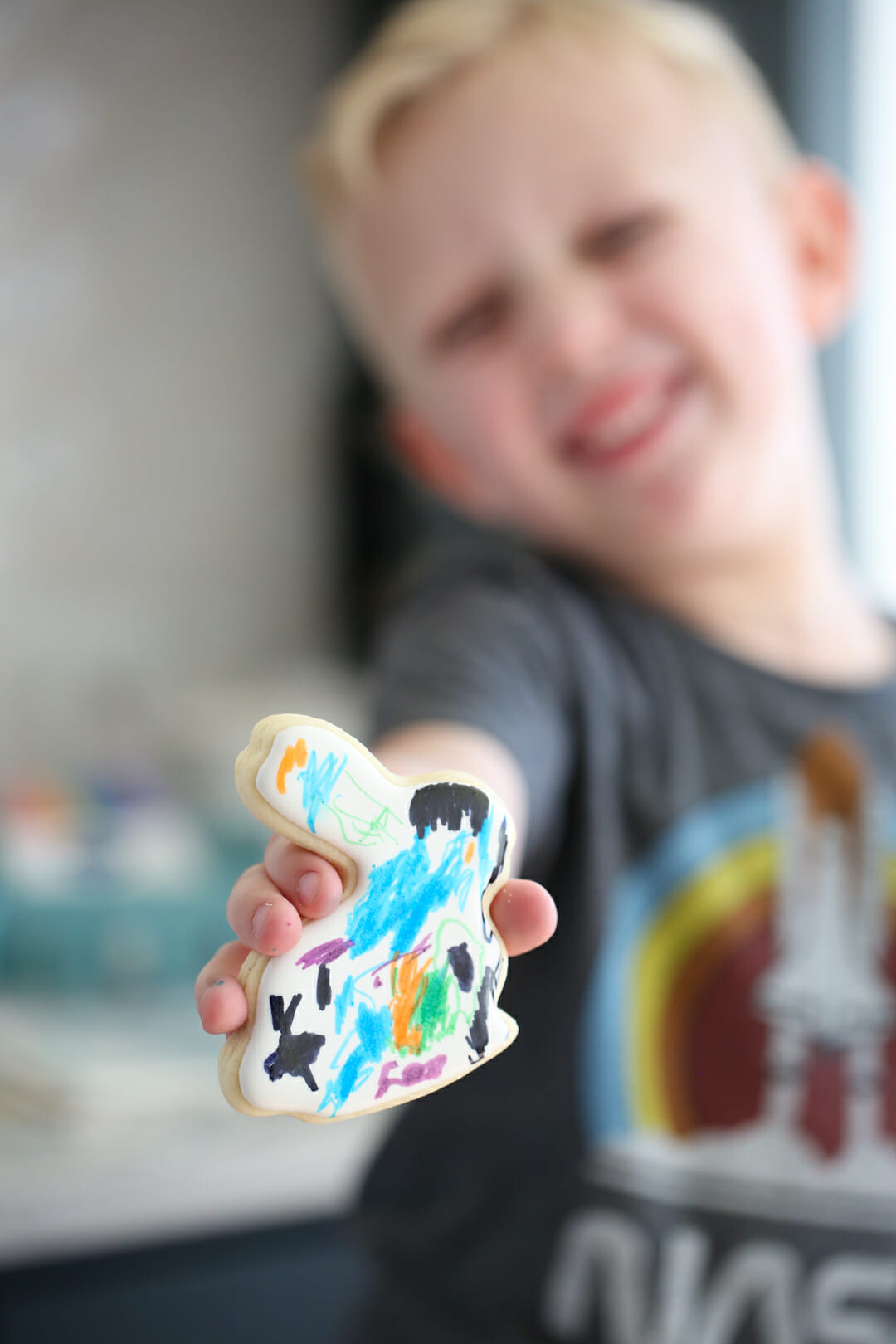 child with easter cookie