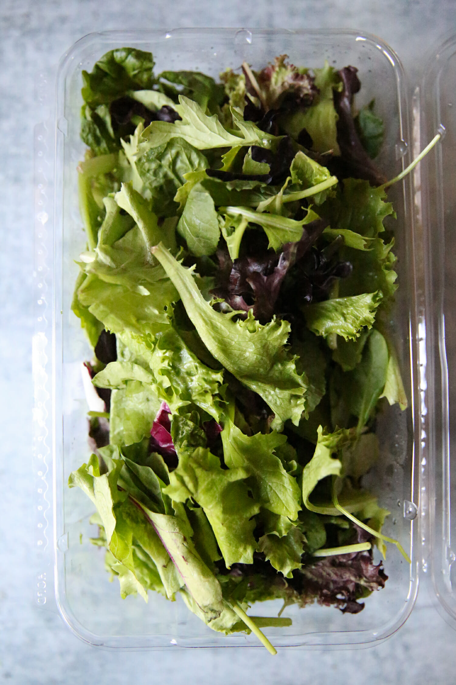 salad greens in carton
