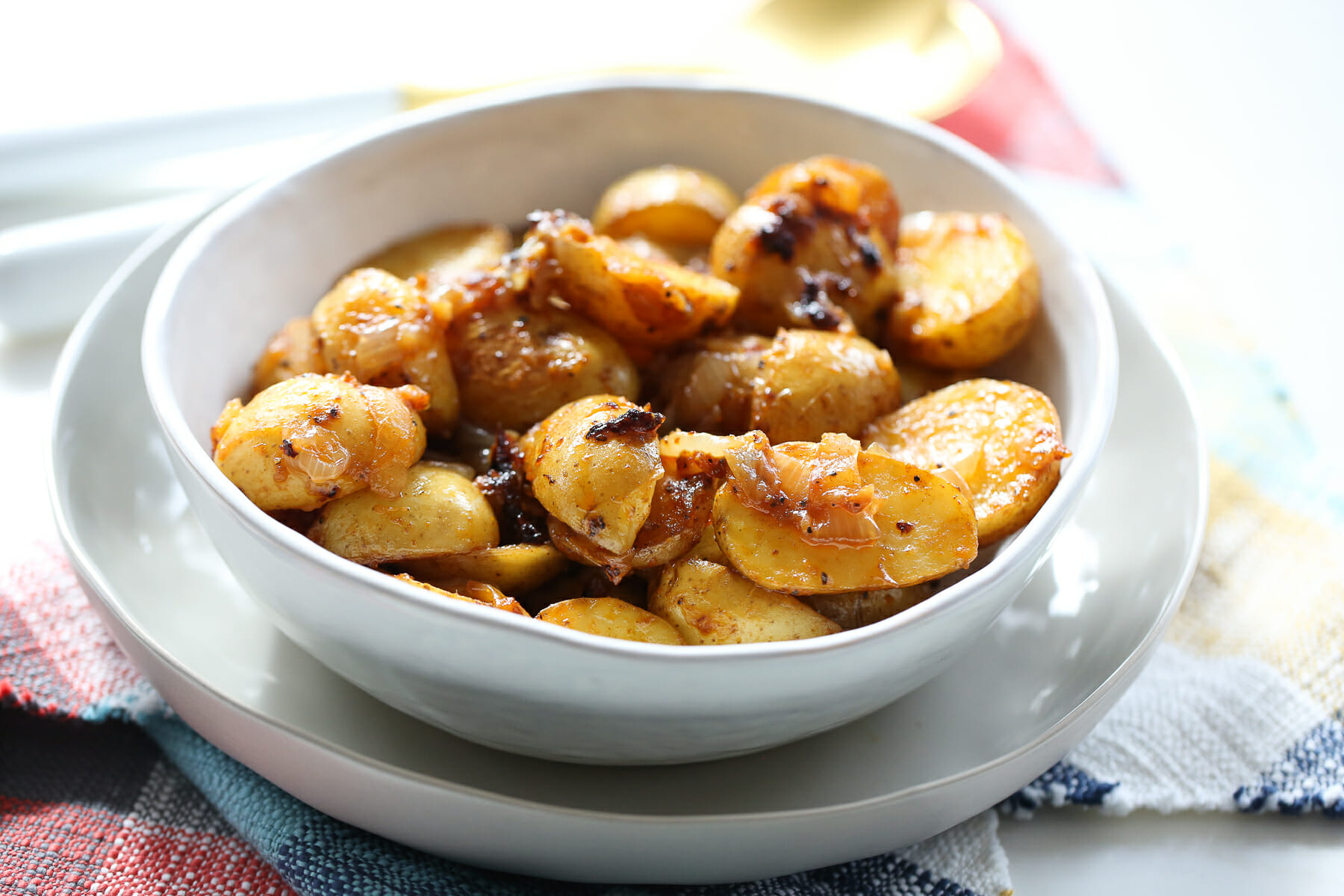 Potatoes and caramelized onions in serving dish