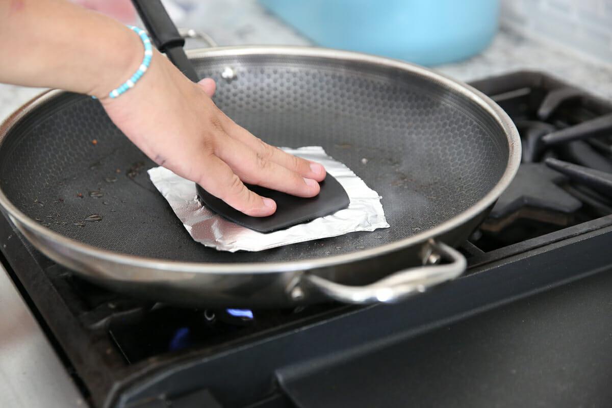 smashing hamburger in a pan