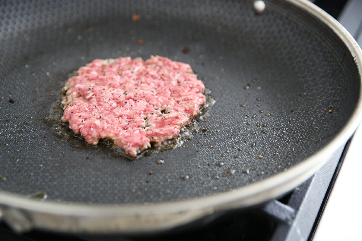 hamburger cooking in pan