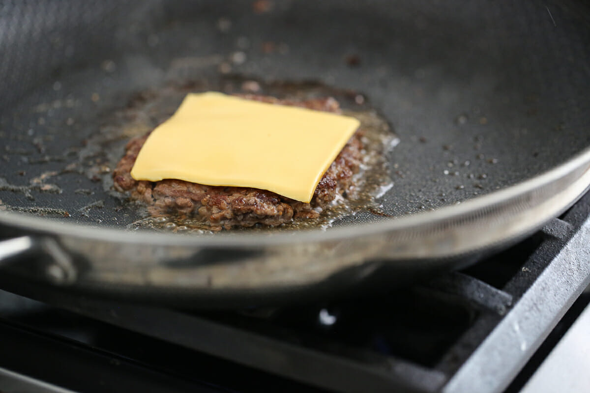 melting cheese on hamburger