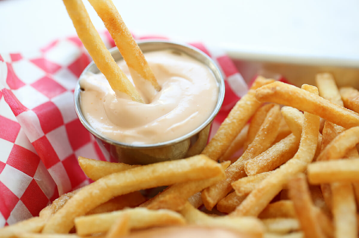 dipping fries in fry sauce