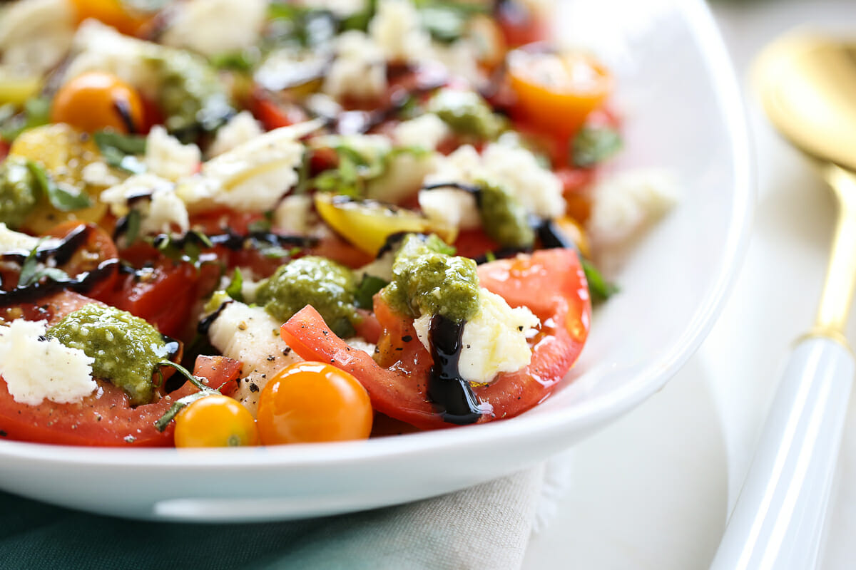 Layered caprese salad in a serving dish