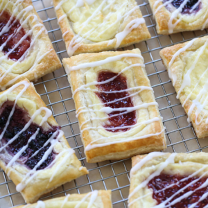 berry and cheese pastries on a cooling rack