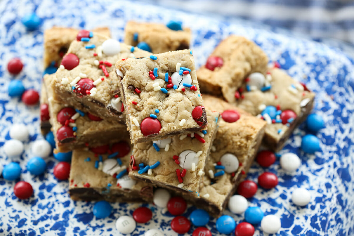 Chocolate chip cookie bars with sprinkles and m&m's on baking tray