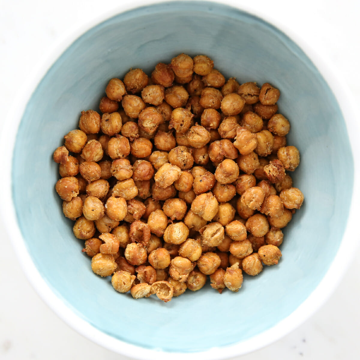 Air-fried chick peas in a light blue bowl