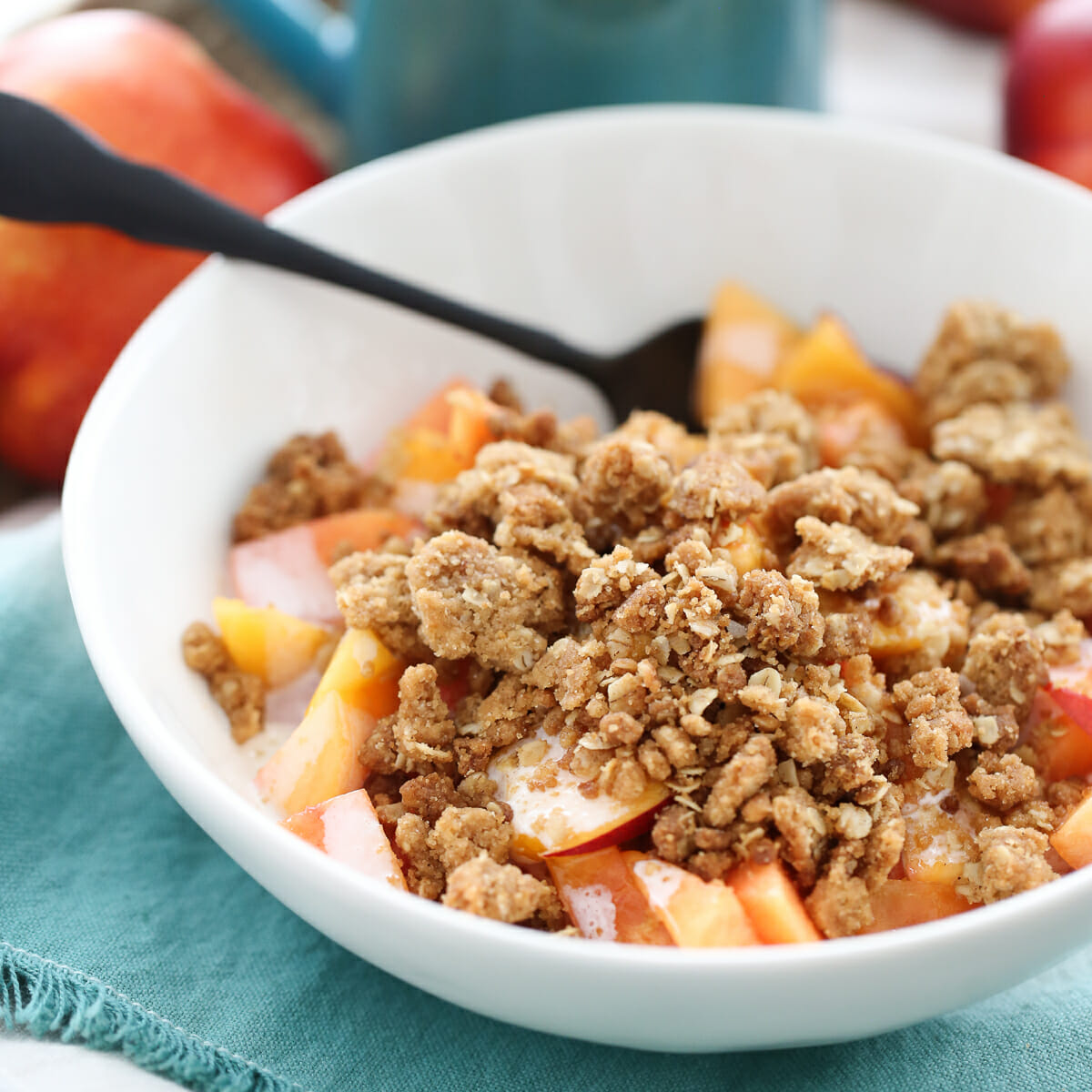 crumble topping over peaches and cream