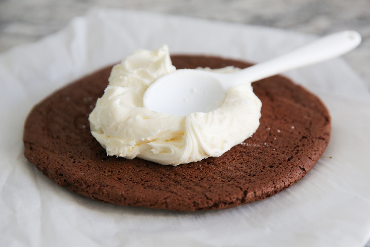 frosting a giant cookie