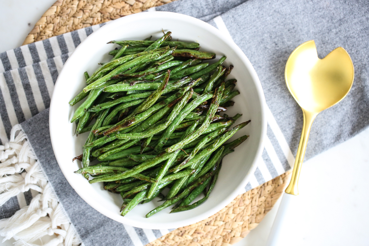 air fried green beans in white bowl