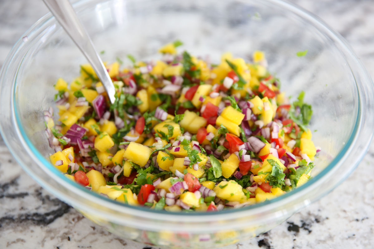 Mango pico de gallo in a glass bowl