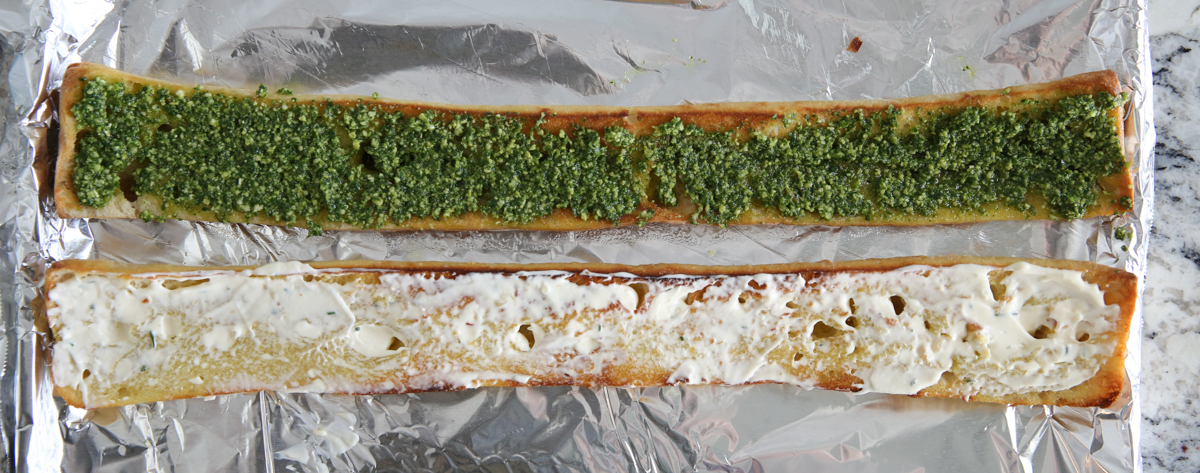 Baguette spread with pesto and mayo