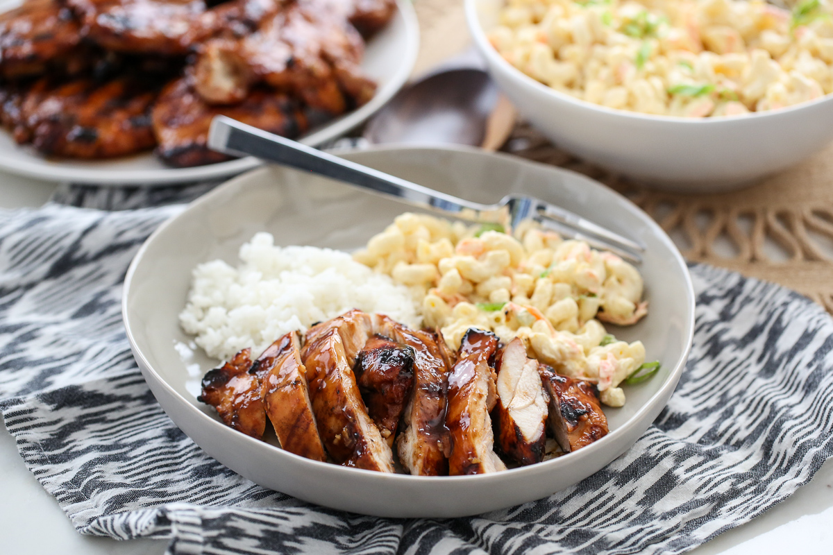 Grilled chicken, white rice, and macaroni salad on a plate.