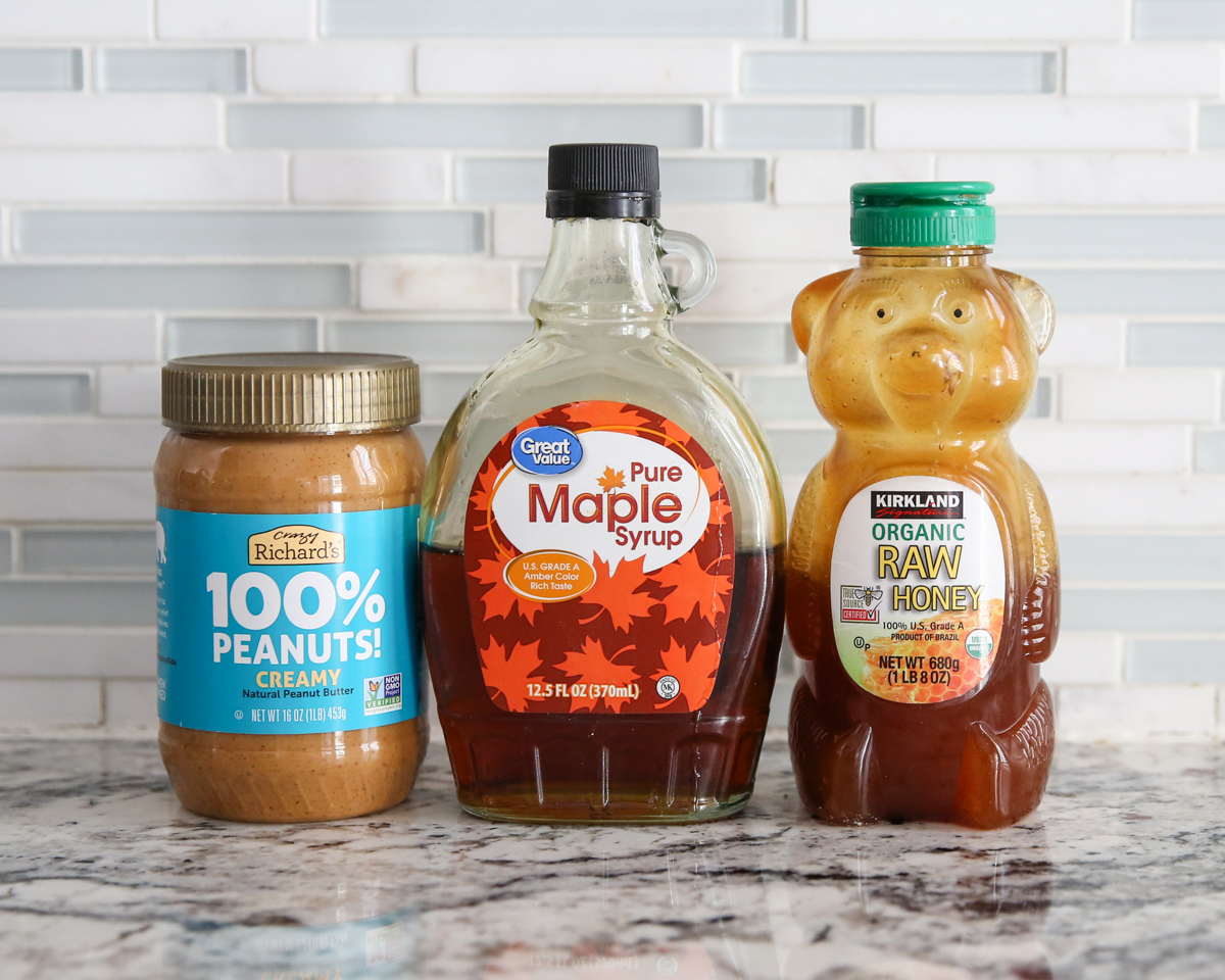 peanut butter, maple syrup, and honey in bottles