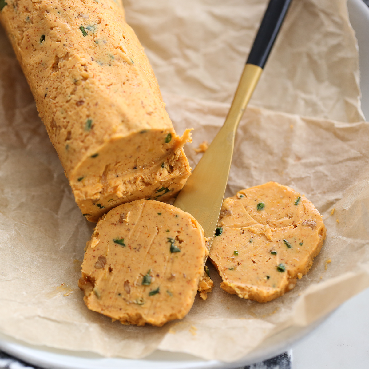 sliced roll of smoked paprika butter