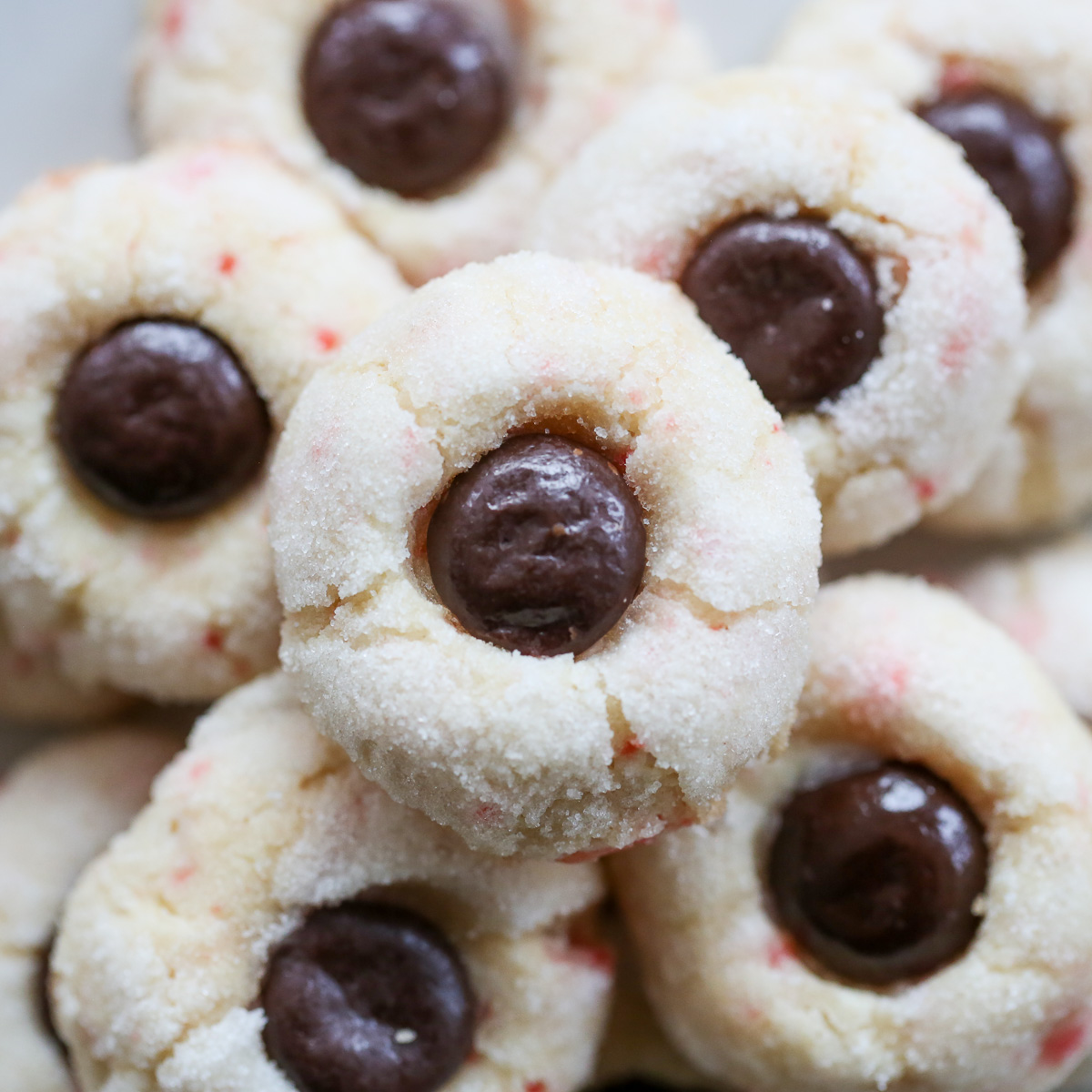 candy cane cookies stacked on a white plate