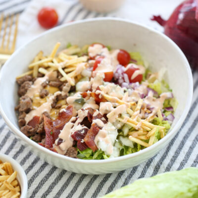 Salad ingredients in a bowl with dressing