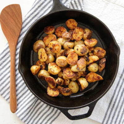Crispy potatoes in a cast iron skillet.