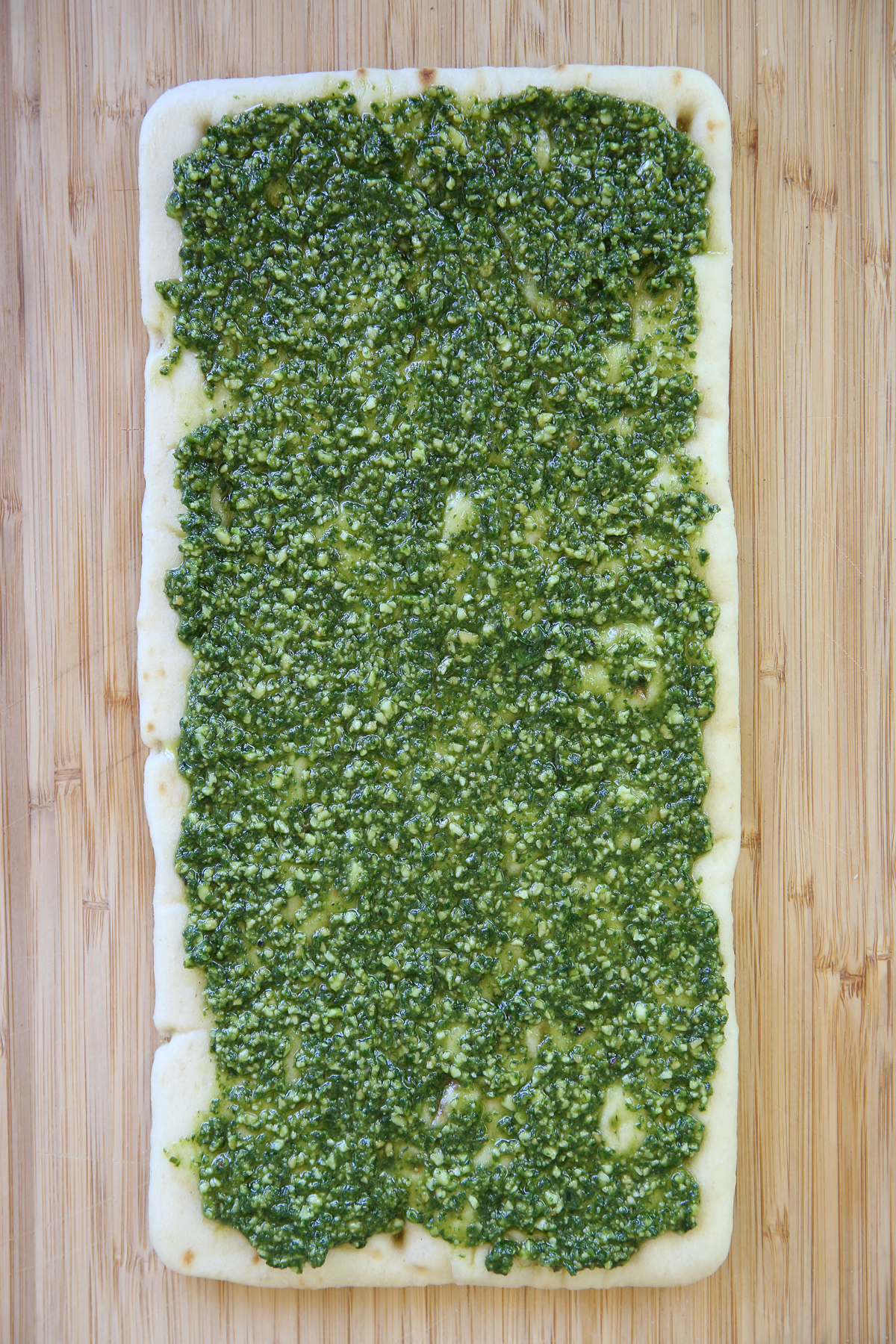 flatbread spread with pesto