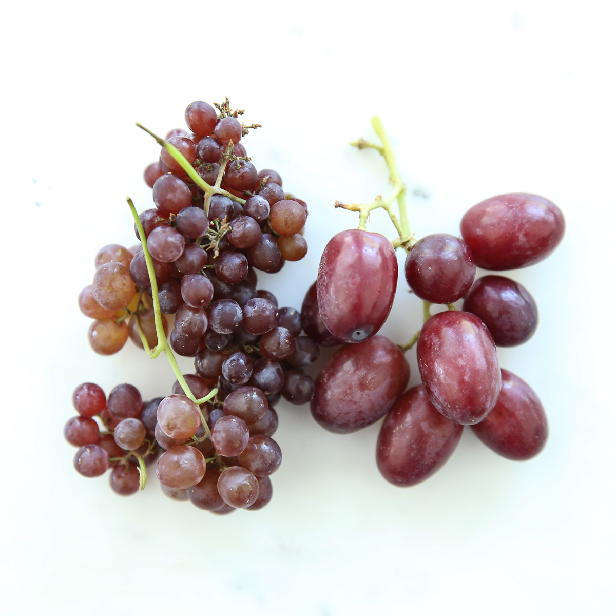 whole grapes next to champagne grapes