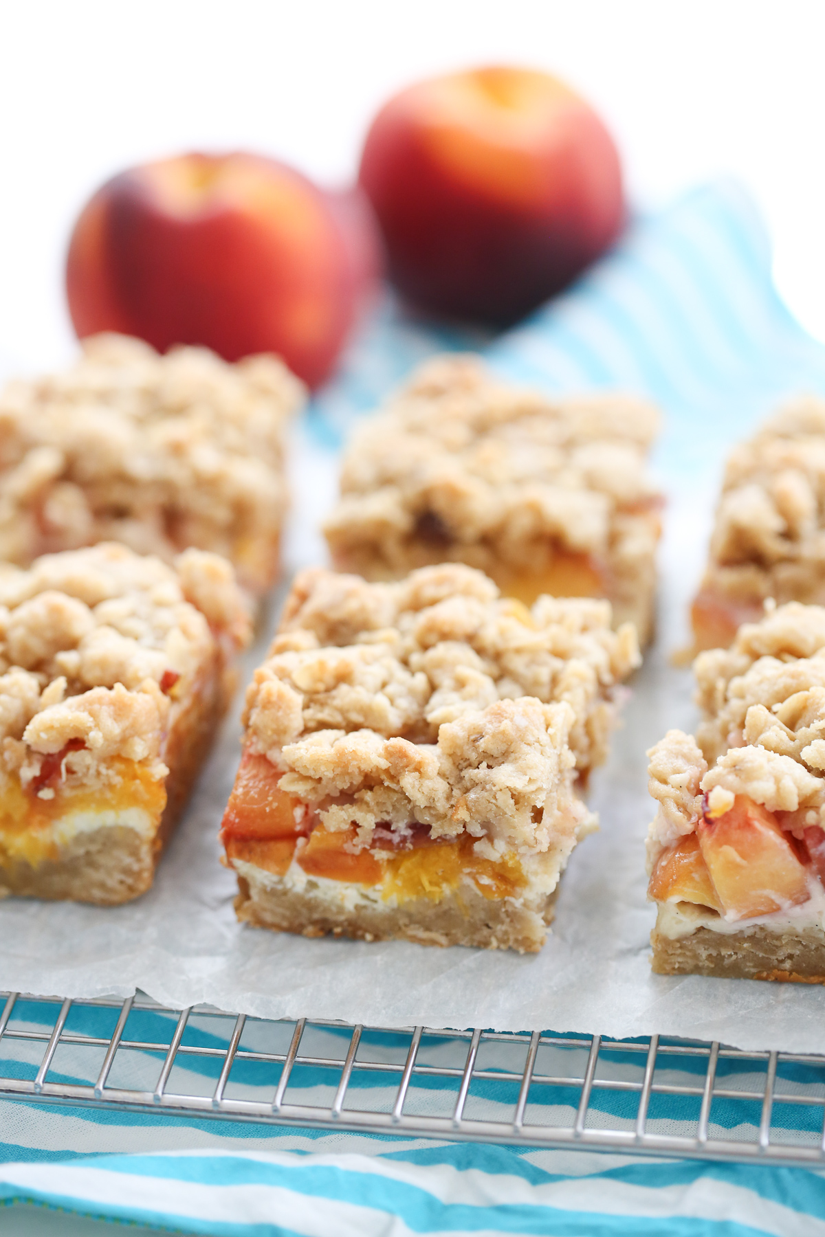 sliced peach cheesecake crumble bars from our best bites