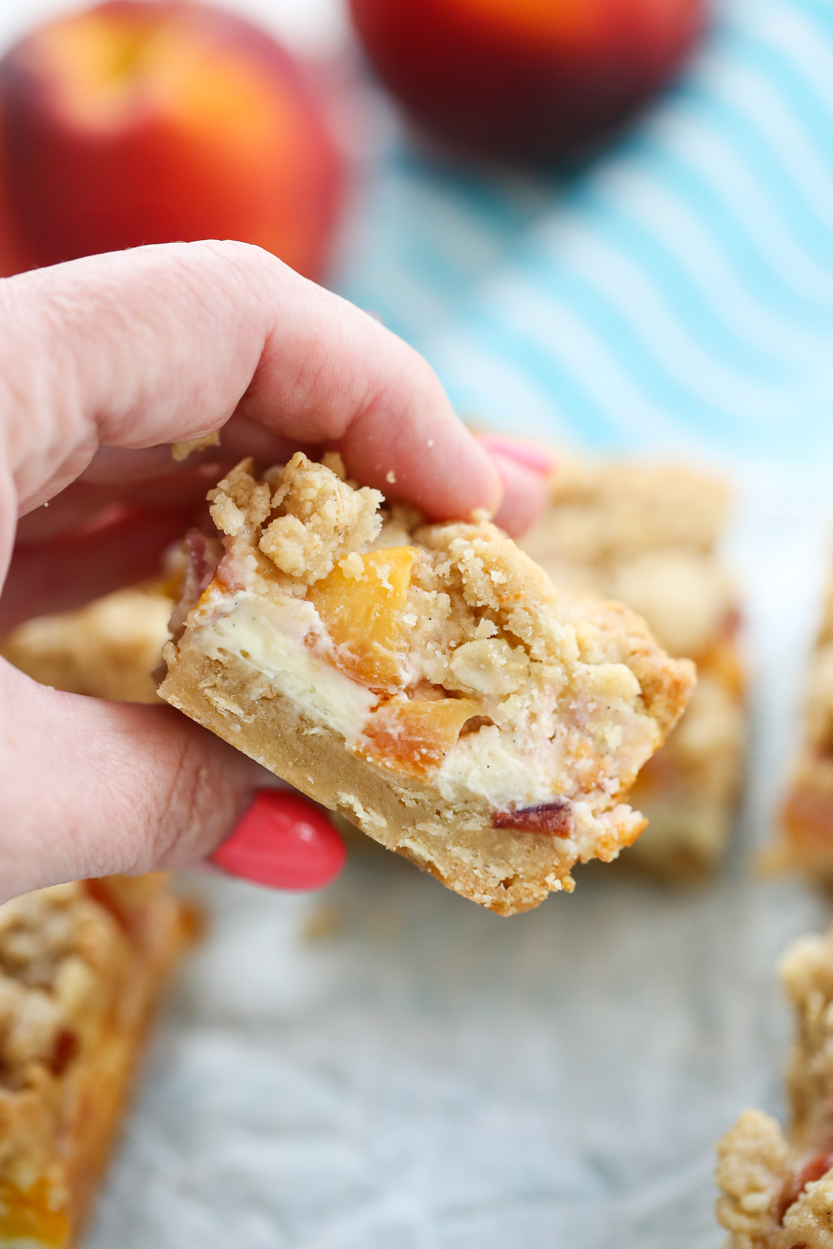 sliced peach cheesecake crumble bars from our best bites