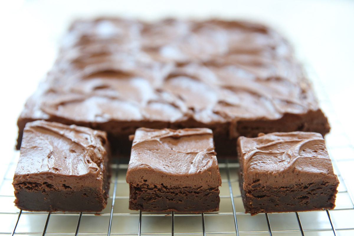 frosted brownies all lined up