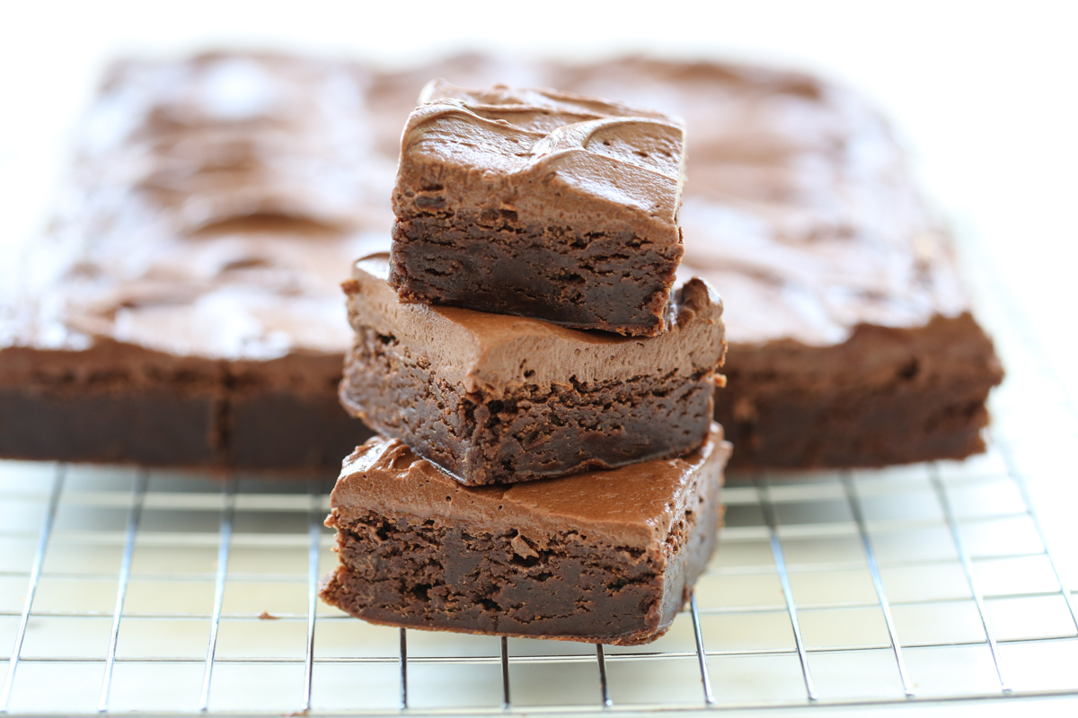 our best bites brownies stacked on top of each other with frosting