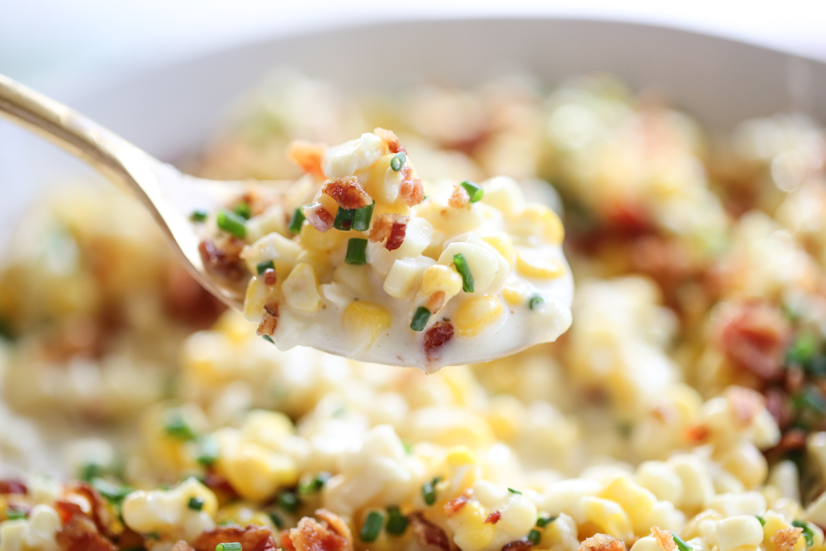 close up photo of creamed corn on a spoon