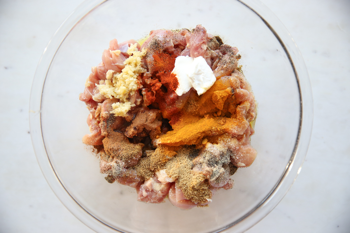 raw chicken with spices in a bowl