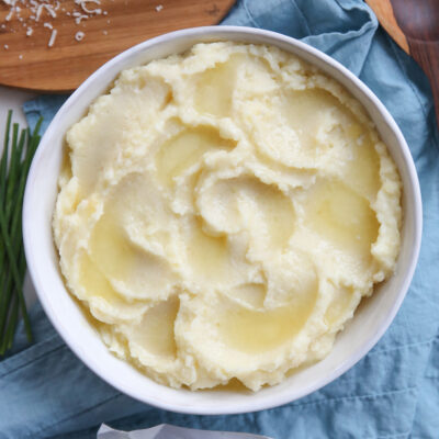 creamy mashed potatoes in a white bowl