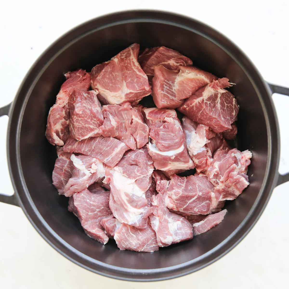 chopped pork in a dutch oven
