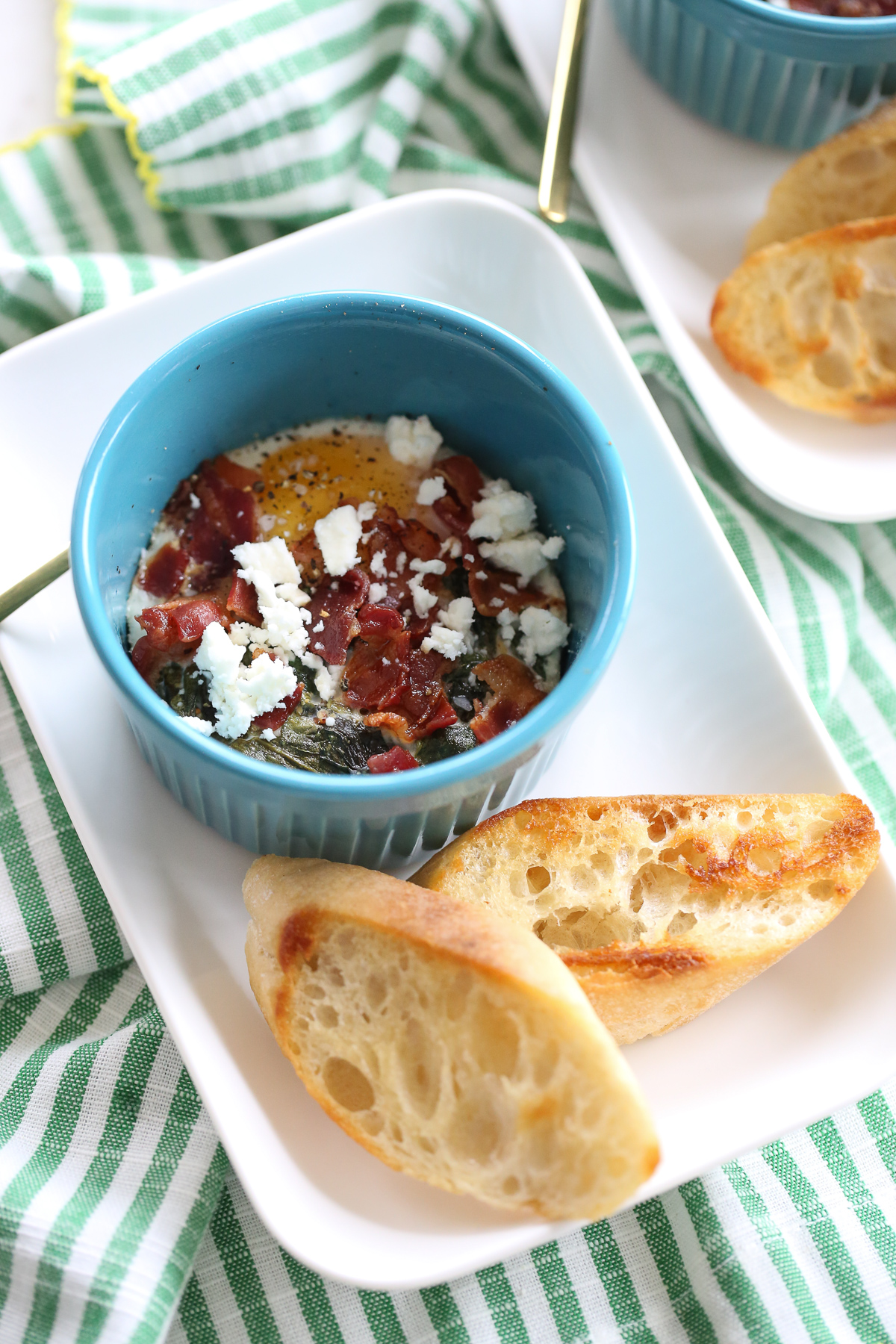 baked eggs in ramekins with toasted baguette