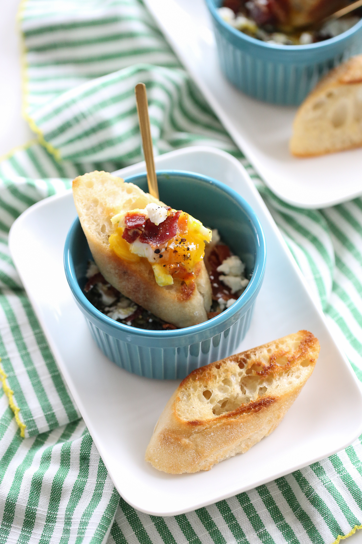 baked eggs in ramekins with toasted baguette
