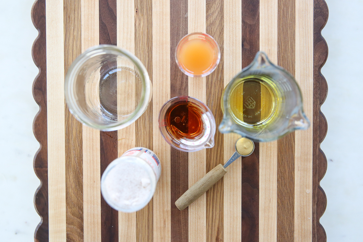 salad dressing ingredients on a cutting board