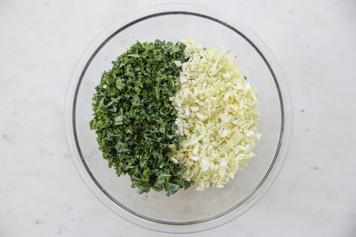 finely chopped cabbage and kale in a glass bowl