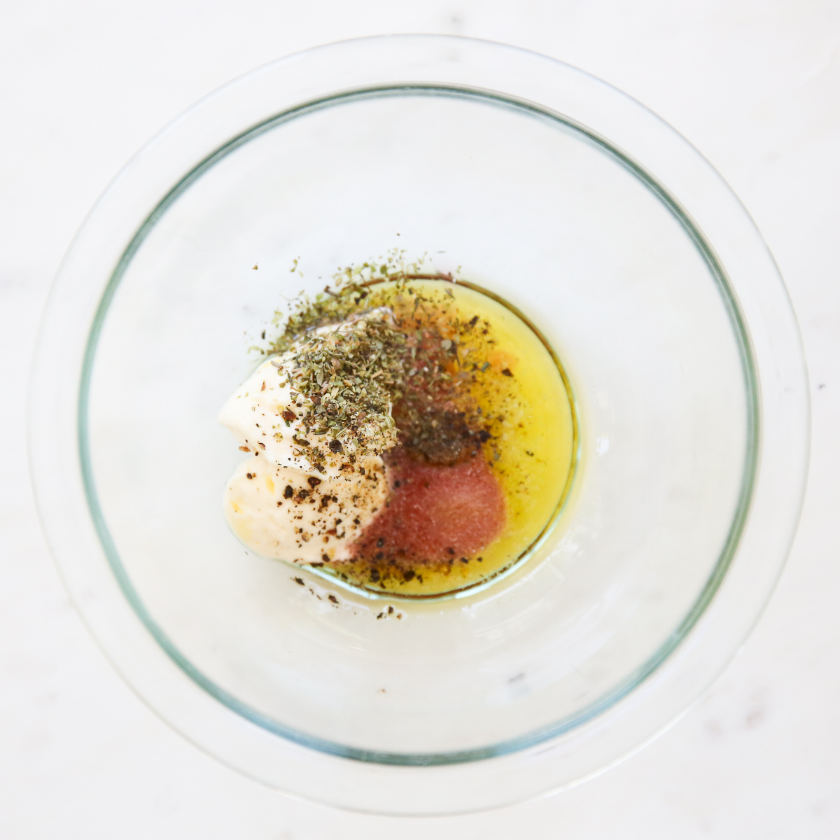 Italian Grinder Salad Dressing in a bowl before whisking