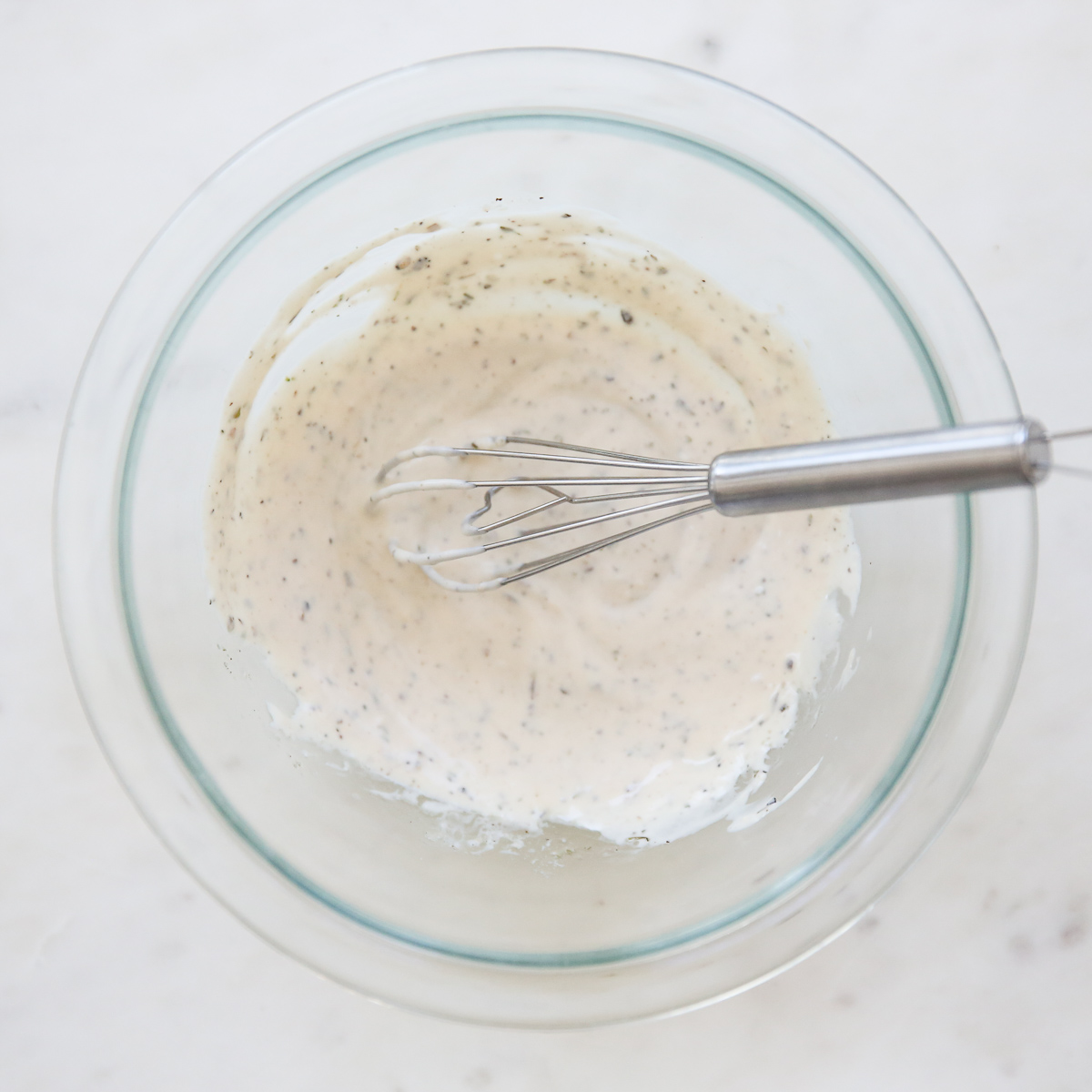 Italian Grinder Salad Dressing in a bowl after whisking