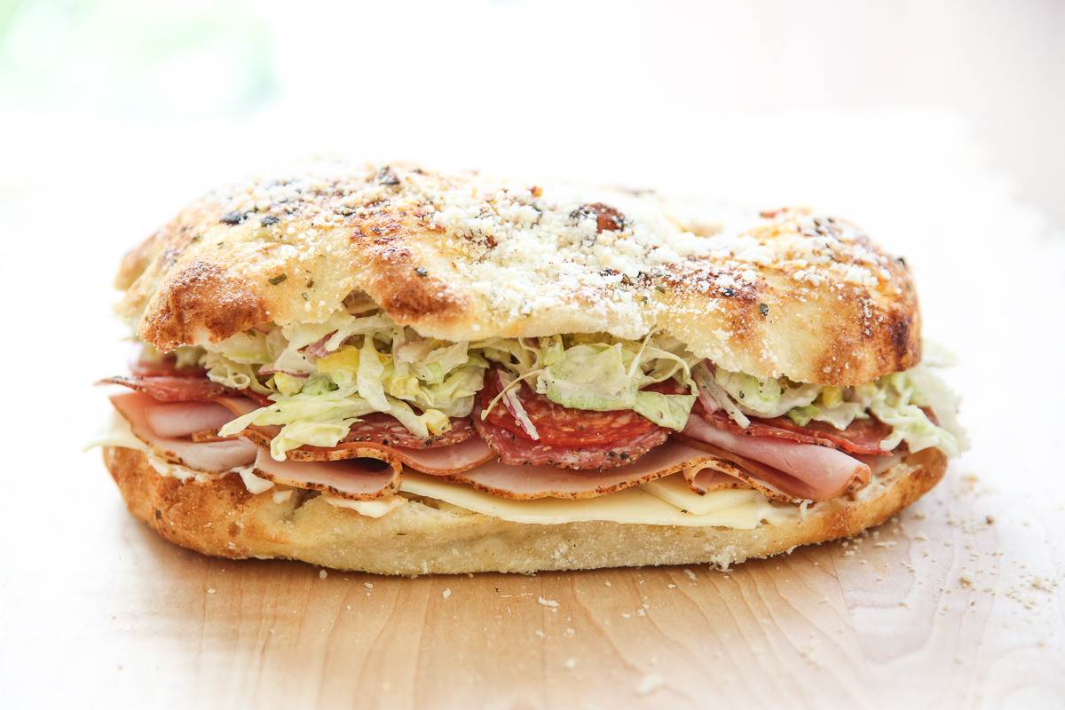 Italian grinder sandwich on a cutting board
